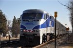 Inbound commuter shoves out of its station stop